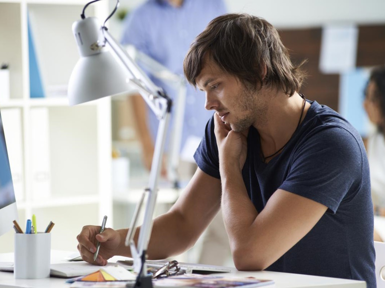 Employee taking notes while on a call