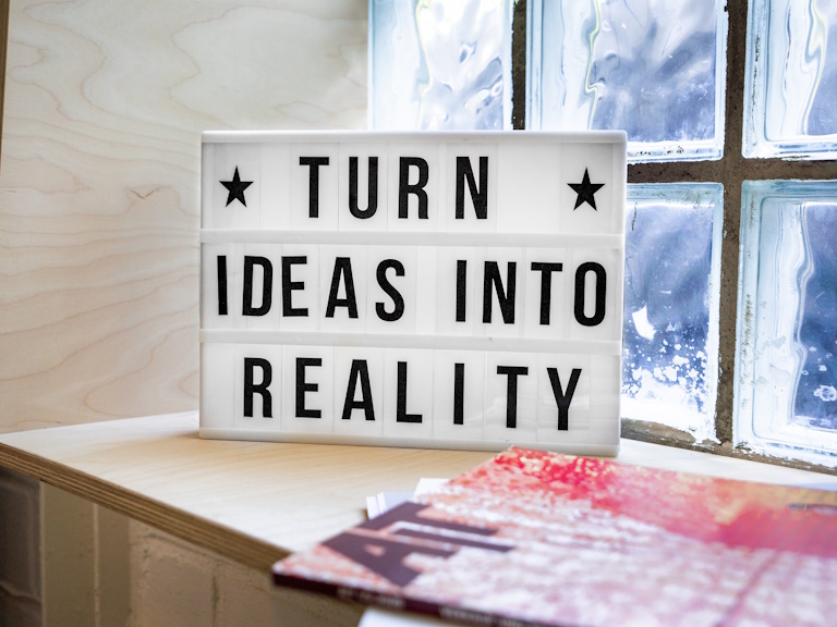 Sign with text "Turn Ideas Into Reality"